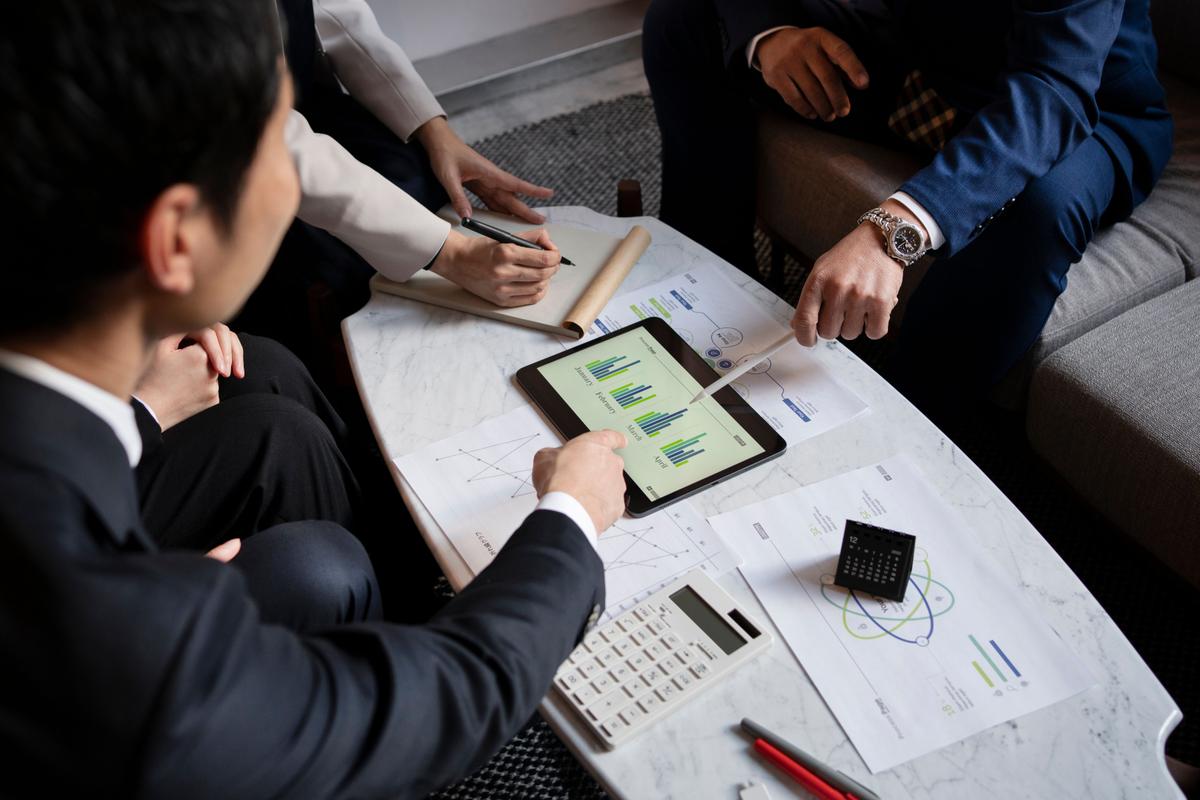 business-people-working-with-ipad-high-angle.jpg